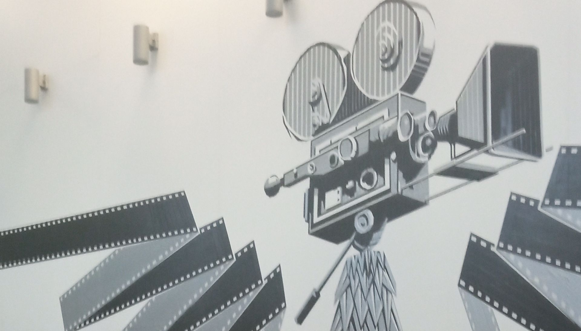 Rysunek kamery filmowej na ścianie